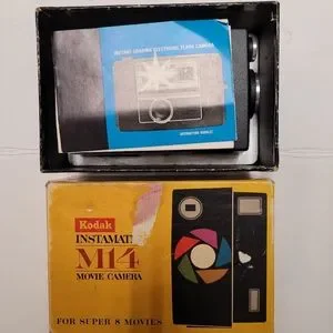 Minolta camera and a Kodak instamatic M14 in case